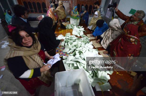 Pakistani election officials begin counting of votes after the closing of voting at a polling station in Peshawar, Pakistan, on February 08, 2024....