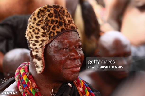 Otumfuo Osei Tutu II, Ghana's Asante king, looks on at the Manhyia Palace in Kumasi, Ghana, on February 8, 2024 during the permanent return of...