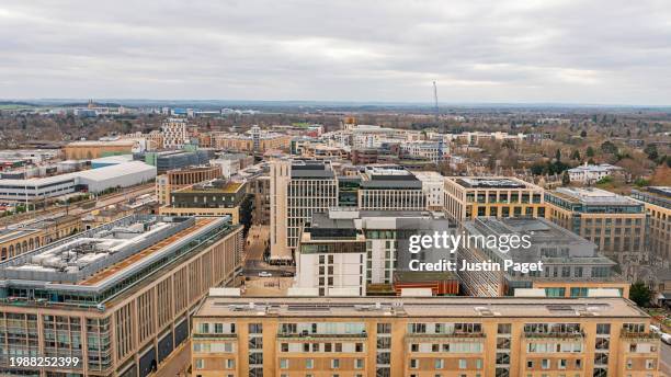 drone/aerial view over a mixture of commercial and residential buildings in cambridge, uk - cambridge uk aerial stock pictures, royalty-free photos & images