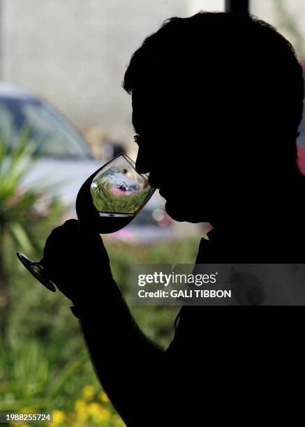 Israelis take part in a wine tasting session at the Dalton Winery in northern Israel near the border with Lebanon, 22 August 2006. Israeli winery...