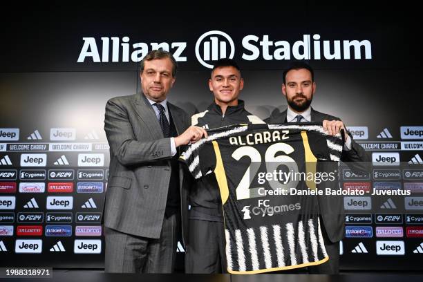 Juventus new signing Carlos Alacaraz pictured with Cristiano Giuntoli and Giovanni Manna during a press conference on February 8, 2024 in Turin,...