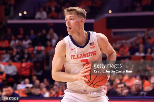 Marcus Domask of the Illinois Fighting Illini looks to pass in the game against the Nebraska Cornhuskers at State Farm Center on February 04, 2024 in...