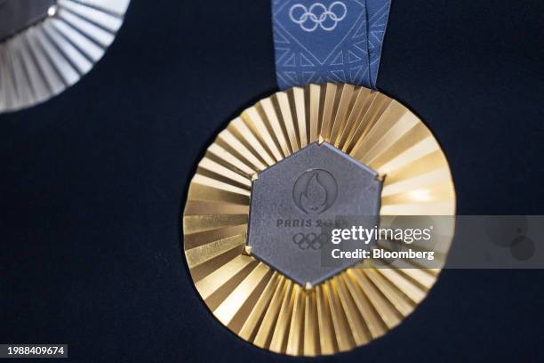 The Chaumet-designed Paris 2024 Olympic gold medal, featuring a hexagon-shaped piece of iron taken from the original Eiffel Tower, unveiled at the...