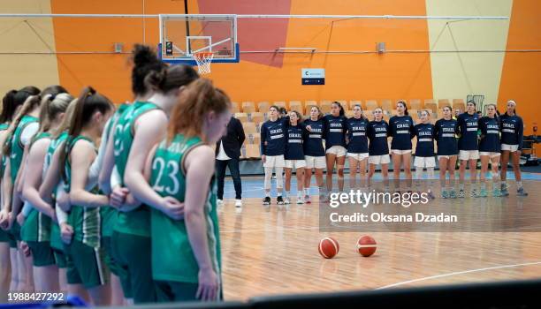 Riga , Latvia - 8 February 2024; The Ireland team stand by their bench as the Israel team stand on the court as the teams stand for their national...