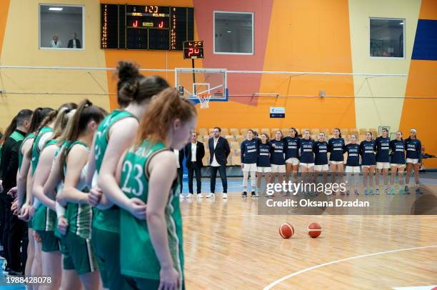 Riga , Latvia - 8 February 2024; The Ireland team stand by their bench as the Israel team stand on the court as the teams stand for their national...