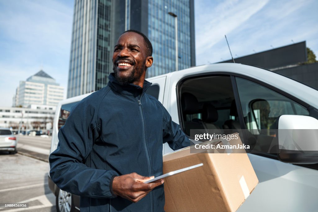 Cheerful Delivery Driver with Package
