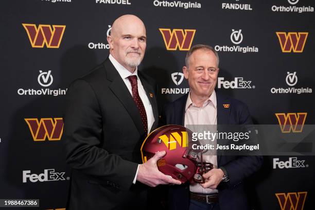 Head coach Dan Quinn of the Washington Commanders poses for a photo with managing partner Josh Harris following a press conference at OrthoVirginia...