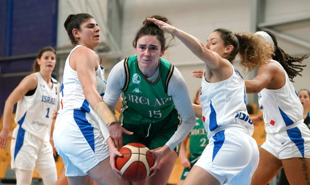 Riga , Latvia - 8 February 2024; Bridget Herlihy of Ireland in action against Daniel Raber and Eden Rotberg of Israel during the FIBA Women's...