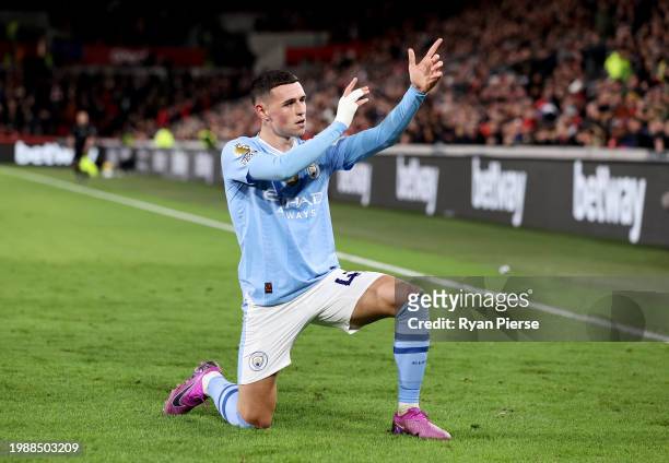 Phil Foden of Manchester City celebrates scoring his team's second goal during the Premier League match between Brentford FC and Manchester City at...