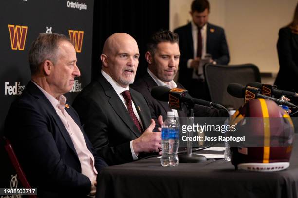Head coach Dan Quinn of the Washington Commanders, center, speaks during an introductory press conference alongside managing partner Josh Harris,...