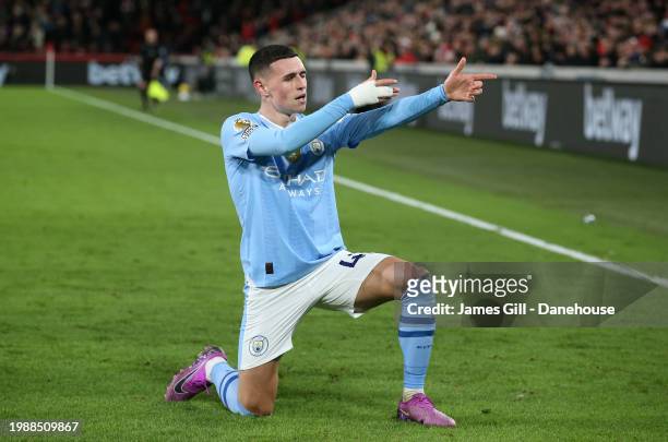 Phil Foden of Manchester City celebrates after scoring their second goal during the Premier League match between Brentford FC and Manchester City at...