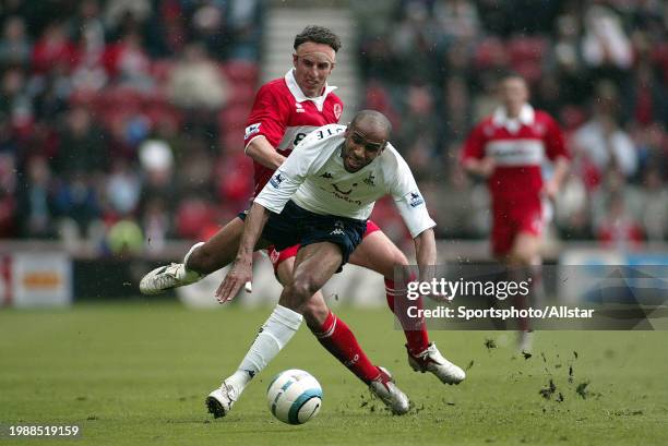 May 7: Gareth Southgate of Middlesbrough and Freddie Kanoute of Tottenham Hotspur challenge during the Premier League match between Middlesbrough and...