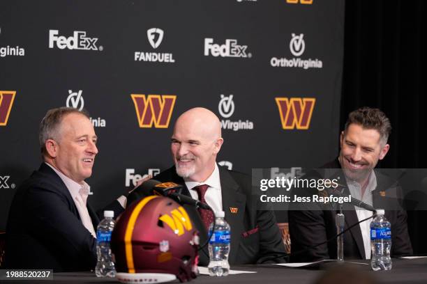 Managing partner Josh Harris of the Washington Commanders introduces head coach Dan Quinn as general manager Adam Peters looks on during a press...