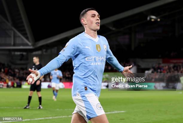 Phil Foden of Manchester City celebrates scoring his team's third goal, his hat-trick, during the Premier League match between Brentford FC and...