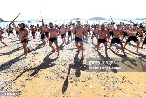 Maori Warriors perform a haka after arriving on beach via waka to commemorate Waitangi Day on on February 06, 2024 in Waitangi, New Zealand. The...