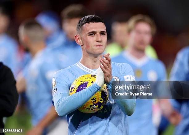 Phil Foden of Manchester City shows appreciation to the fans following the Premier League match between Brentford FC and Manchester City at Brentford...