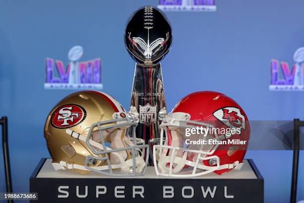 General view of the Vince Lombardi Trophy with the San Francisco 49ers and Kansas City Chiefs helmets during a press conference ahead of Super Bowl...