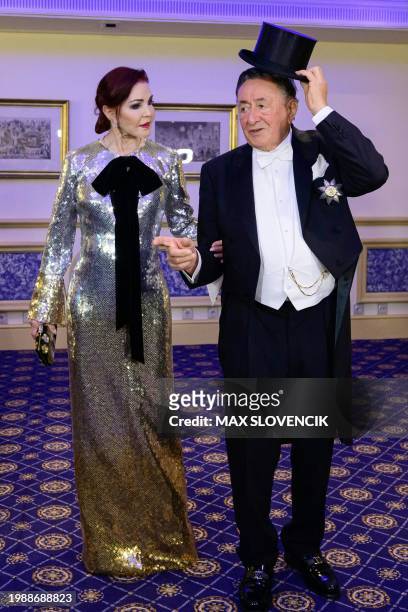 Actress Priscilla Presley and Austrian entrepreneur Richard Lugner react during a photo call on February 8, 2024 in Vienna, Austria, where she will...