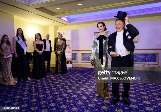 Actress Priscilla Presley and Austrian entrepreneur Richard Lugner react during a photo call on February 8, 2024 in Vienna, Austria, where she will...