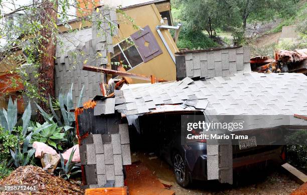 View of mudslide damage which destroyed a home as a powerful long-duration atmospheric river storm, the second in less than a week, continues to...