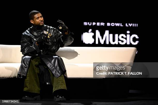 Singer and songwriter Usher speaks during a press conference ahead of Super Bowl LVIII in Las Vegas, Nevada on February 8, 2024. Usher is slated to...