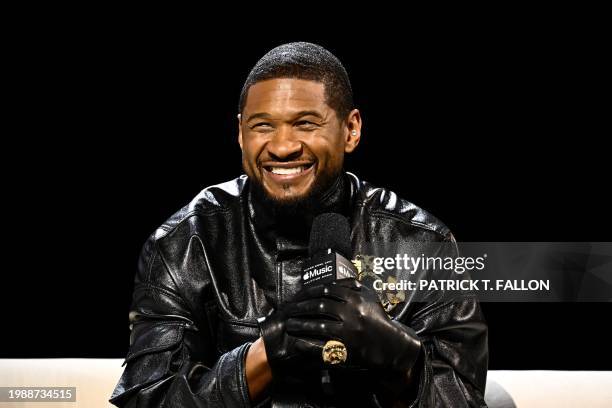 Singer and songwriter Usher speaks during a press conference ahead of Super Bowl LVIII in Las Vegas, Nevada on February 8, 2024. Usher is slated to...