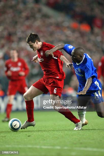 May 3: John Arne Riise of Liverpool and Geremi of Chelsea challenge during the Champions League Semi-final match between Liverpool and Chelsea at...