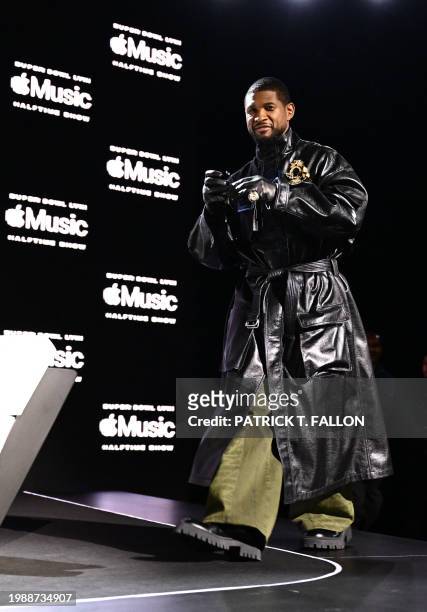 Singer and songwriter Usher arrives to speak during a press conference ahead of Super Bowl LVIII in Las Vegas, Nevada, on February 8, 2024. Usher is...