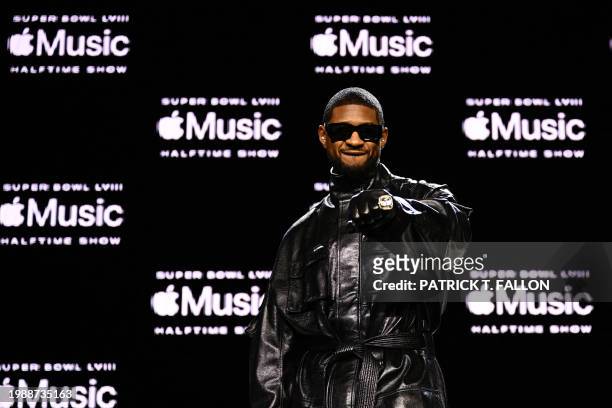 Singer and songwriter Usher poses for photos during a press conference ahead of Super Bowl LVIII in Las Vegas, Nevada on February 8, 2024. Usher is...