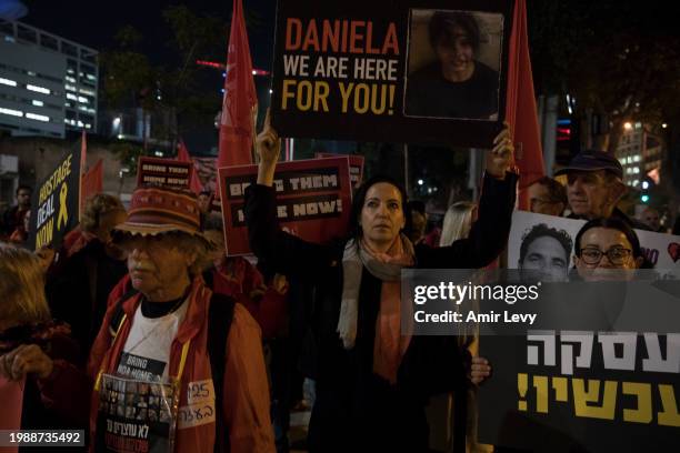 Famlies of hostages held in Gaza by Hamas and other protesters take part in a demonstration outside the Israeli cabinet meeting on February 8, 2024...