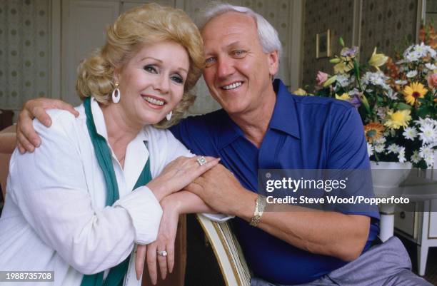 Amercian actress Debbie Reynolds with husband Richard Hamlett in London, England, circa 1985.