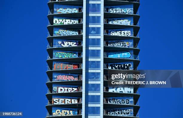 Several floors of a downtown Los Angeles high-rise covered in graffiti are seen on February 8, 2024 in California. The three-tower complex has been...