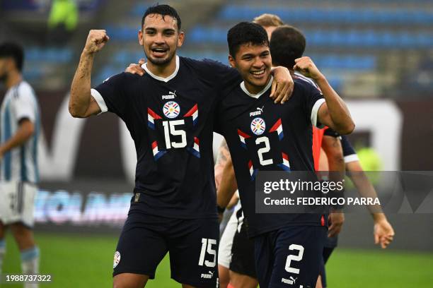 Paraguay's Alan Nuñez celebrates with Fabrizio Peralta after scoring during the Venezuela 2024 CONMEBOL Pre-Olympic Tournament football match between...