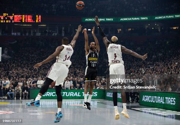 Kevin Punter, #7 of Partizan Mozzart Bet Belgrade in action against Serge Ibaka, #14 of FC Bayern Munich and Isaac Bonga, #9 of FC Bayern Munich...