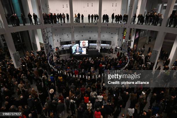 February 2024, Bavaria, Munich: Flatz, artist from Austria, stands naked on a stage in the Pinakothek der Moderne during a performance at the opening...