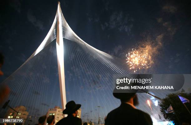 Ultra-Orthodox Jews watch fireworks during the inauguration ceremony of the 'Chords Bridge' , designed by Spanish architect Santiago Calatrava, at...