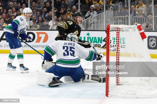 Danton Heinen of the Boston Bruins scores against Thatcher Demko of the Vancouver Canucks during the first period at the TD Garden on February 8,...