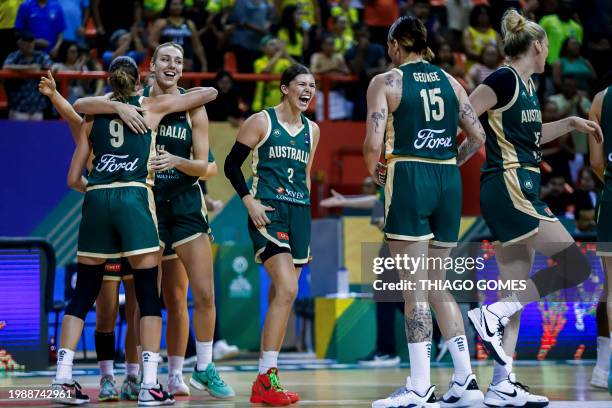Australian players celebrate their victory during the women's Pre-olympic Tournament match between Brazil and Australia at the Arena Guilherme...