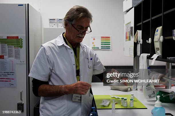 Wim Distelmans, Professor in palliative care, prepares the lethal injection at a hospital in Belgium, on February 1, 2024. Lydie Imhoff, a 43...
