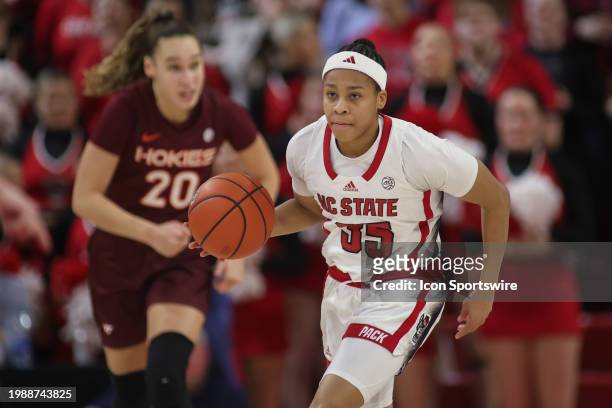 State Wolfpack guard Zoe Brooks brings the ball up court during the college basketball game between the NC State Wolfpack and the Virginia Tech...