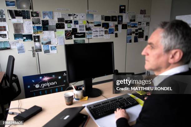 Vincent Costes, former head of the "Groupe d'Etude et d'Information sur les Phenomenes Aerospatiaux Non identifies" , poses in his GEIPAN office;...