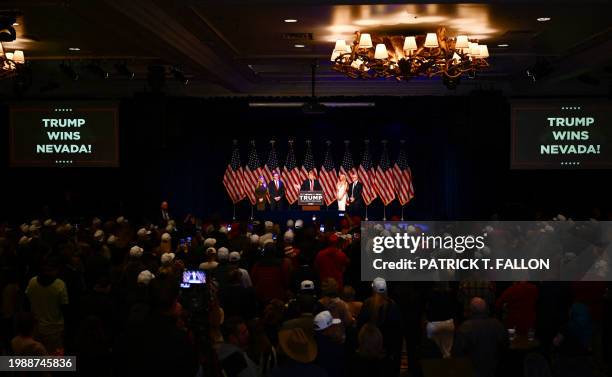 Republican Governor of North Dakota Doug Burgum and his wife Kathryn , Jets owner Woody Johnson and his wife Suzanne listen to former US President...