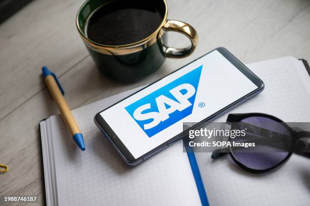 In this photo illustration a SAP logo seen displayed on a smartphone.