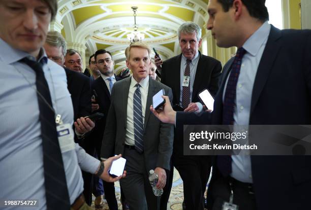 Sen. James Lankford talks to reporters as he makes his way to a meeting at the U.S. Capitol on February 05, 2024 in Washington, DC. The Senate is...