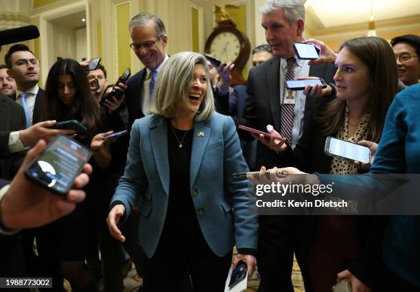 Sen. Joni Ernst and Sen. John Thune laugh as they walk to the Senate Chamber s at the U.S. Capitol on February 05, 2024 in Washington, DC. The Senate...