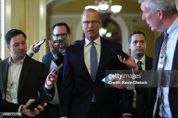 Sen. John Thune talks to reporters as he walks to Senate Minority Leader Mitch McConnell's office at the U.S. Capitol on February 05, 2024 in...