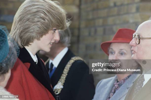 Diana, Princess of Wales , wearing a Catherine Walker coat, talks to visitors at the Charlie Chaplin Adventure Playground for handicapped children in...