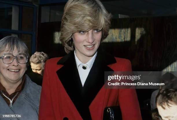 Diana, Princess of Wales , wearing a Catherine Walker coat, smiles during her visit to the Charlie Chaplin Adventure Playground for handicapped...