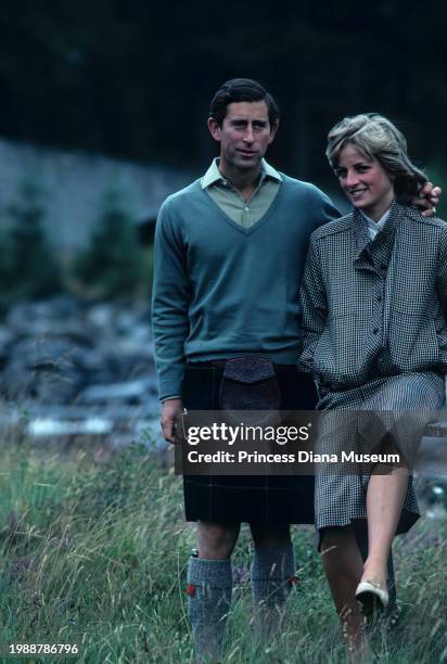 Charles III of the United Kingdom and Diana, Princess of Wales , wearing a suit designed by Bill Pashley, pose for a portrait along the banks of the...