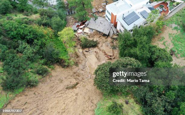 An aerial view of a home destroyed by a mudslide as a powerful long-duration atmospheric river storm, the second in less than a week, continues to...